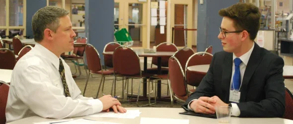 two people sitting at a table