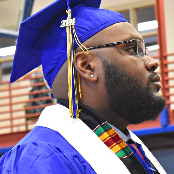 A Greensburg student wears his graduation cap and gown.