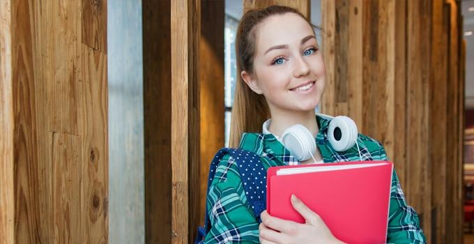 student holding a folder