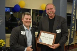 Thomas Jollie accepting award